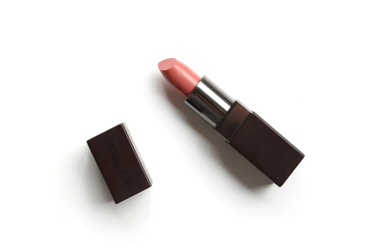 Flat-lay of nude pink lipstick for use as cosmetics and makeup