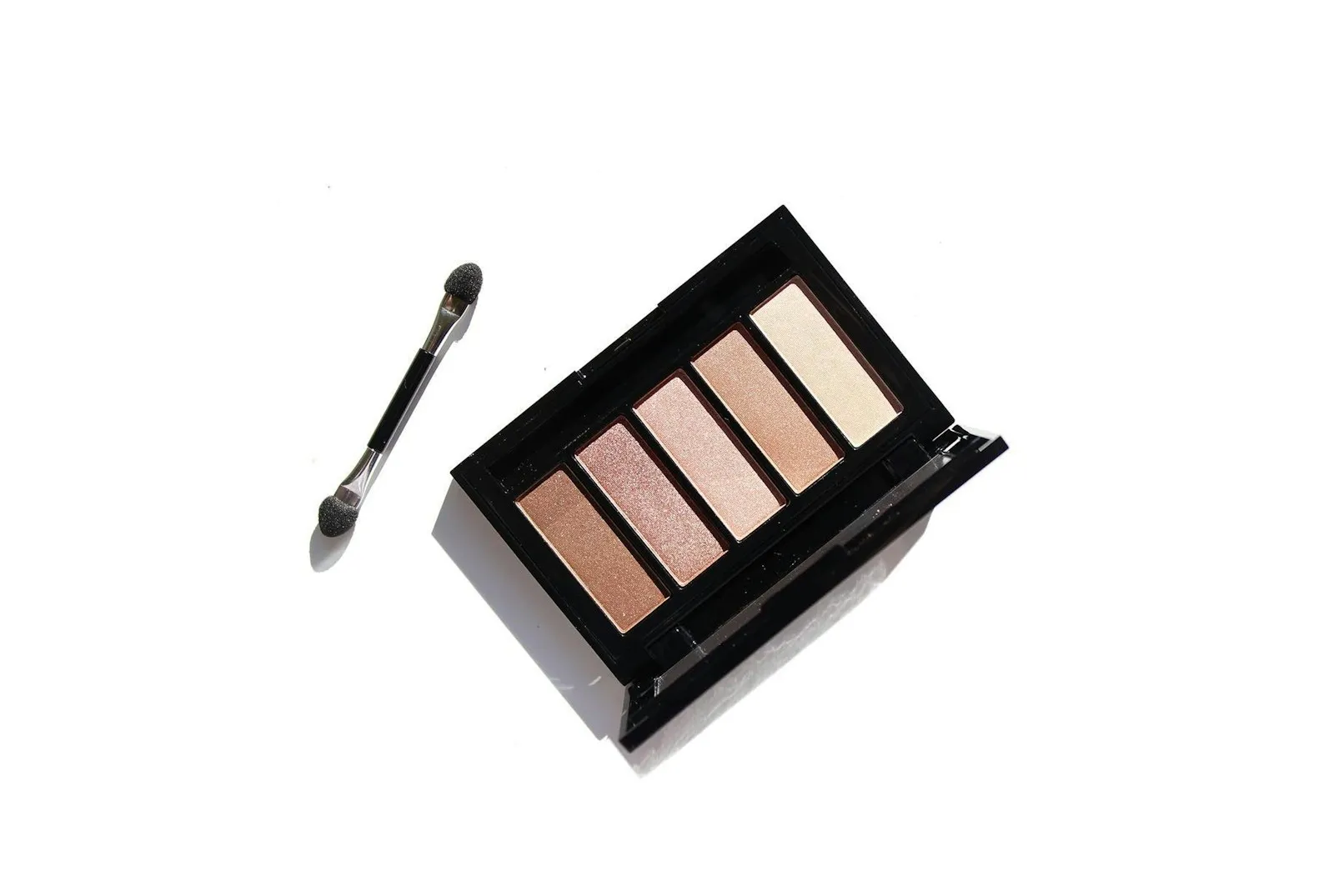 Brown Eyeshadow Palette for makeup and cosmetic use on plain white background flatlay