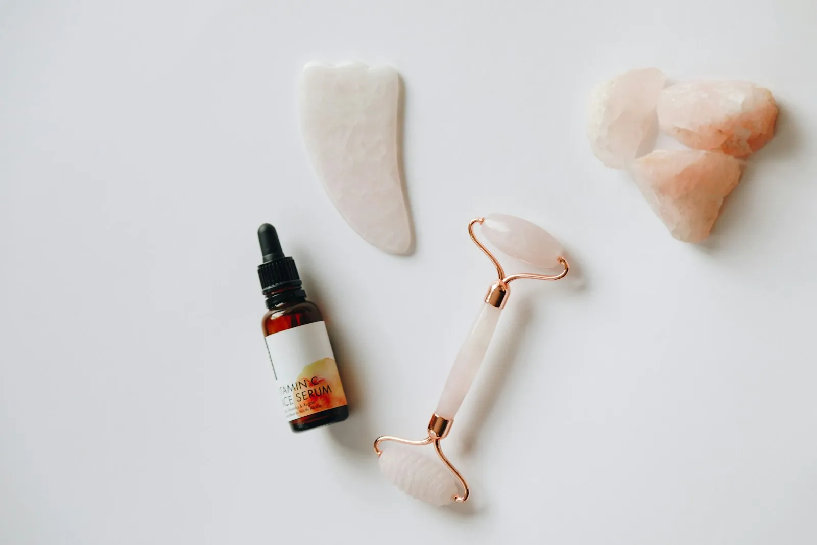 Rose quartz face roller and guasha with Vitamin C oil
