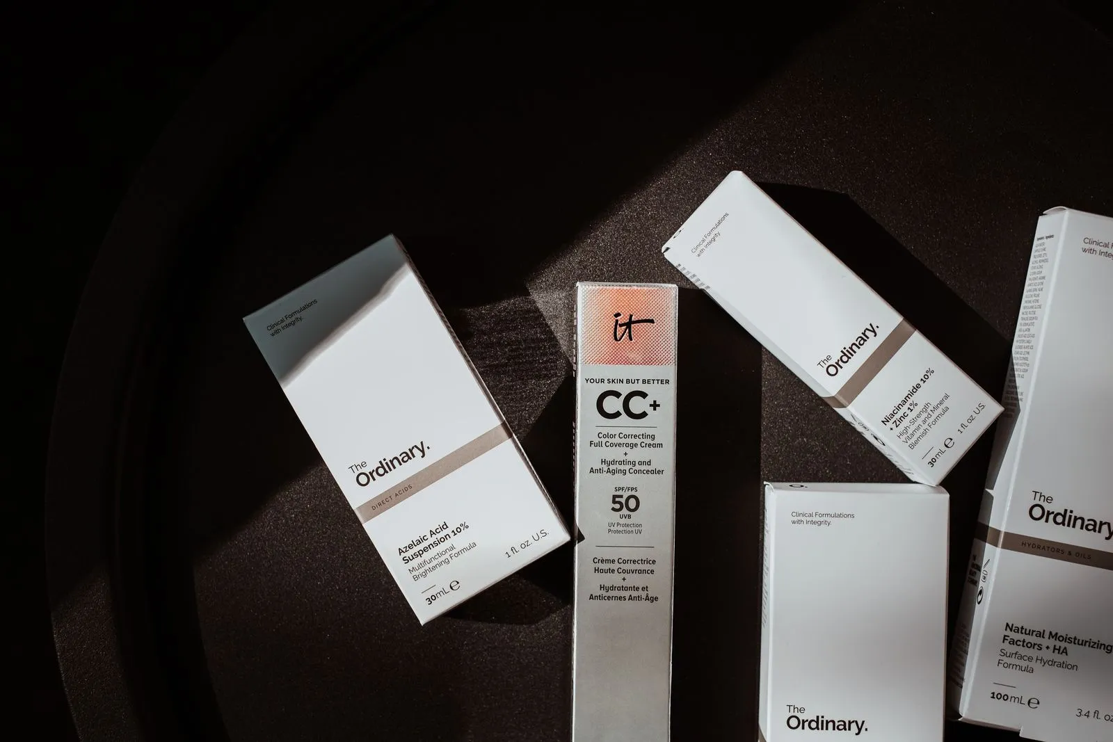Elegant flat lay of skincare products in soft lighting.