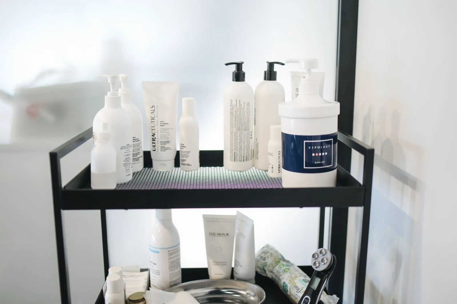 A chic arrangement of skincare products on a shelf at a beauty salon for professional use.