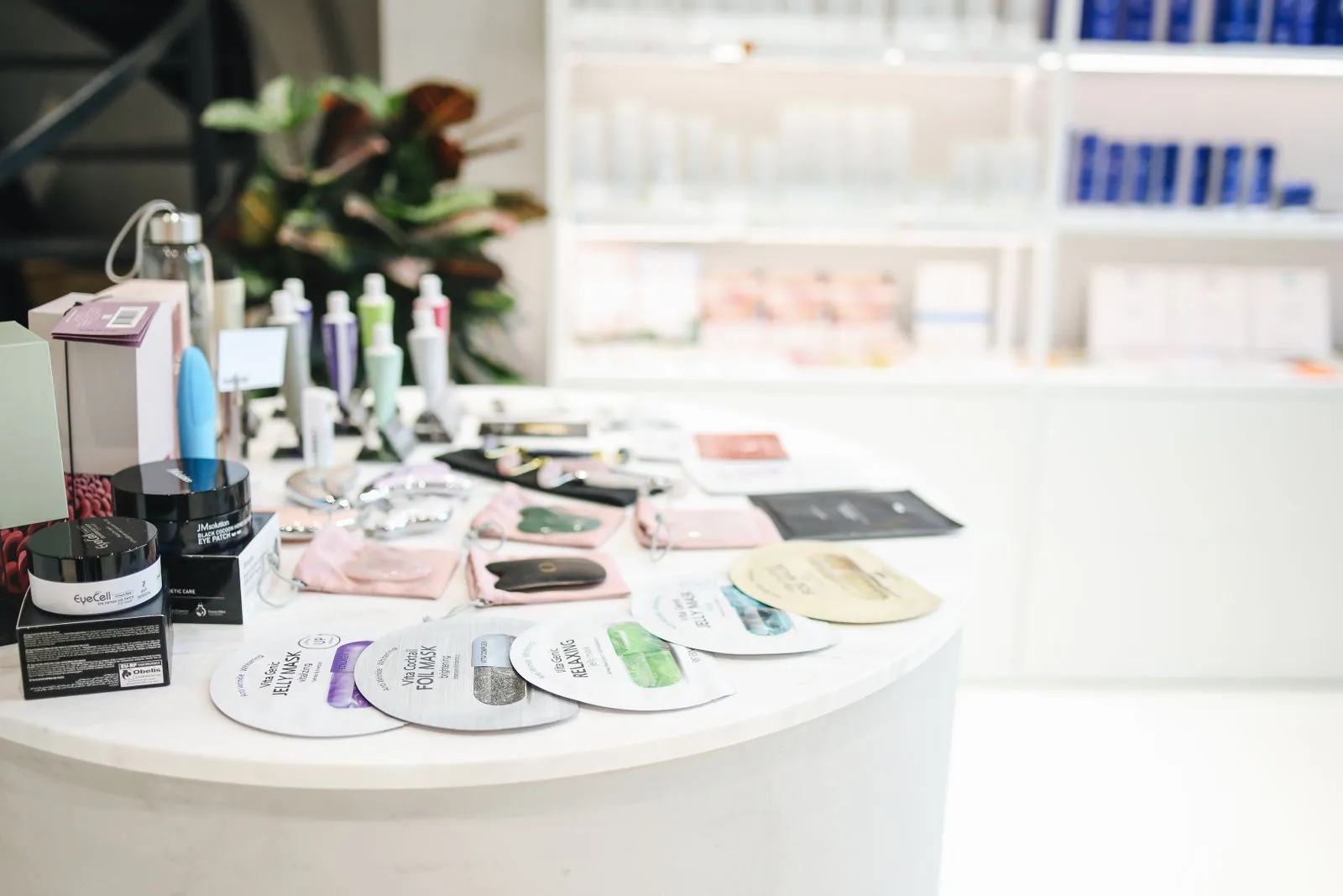 Wide selection of skincare and beauty products displayed in a modern retail setting.