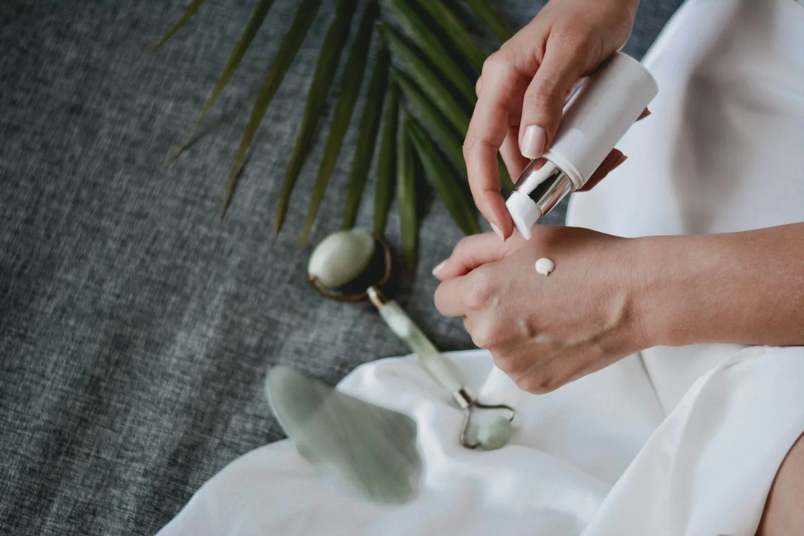 Facial massage with gua sha and jade roller