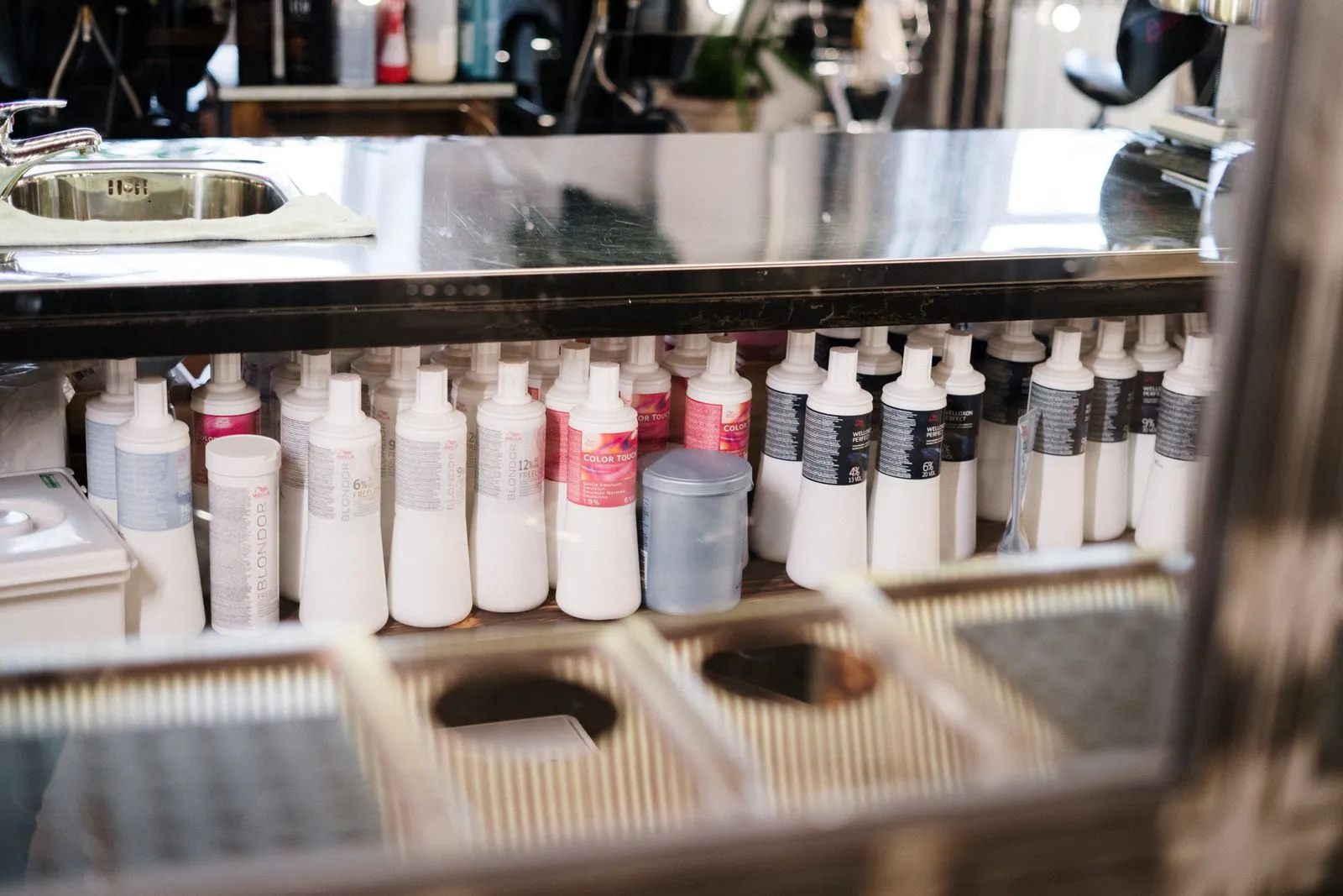 A neat arrangement of hair care products on a salon shelf