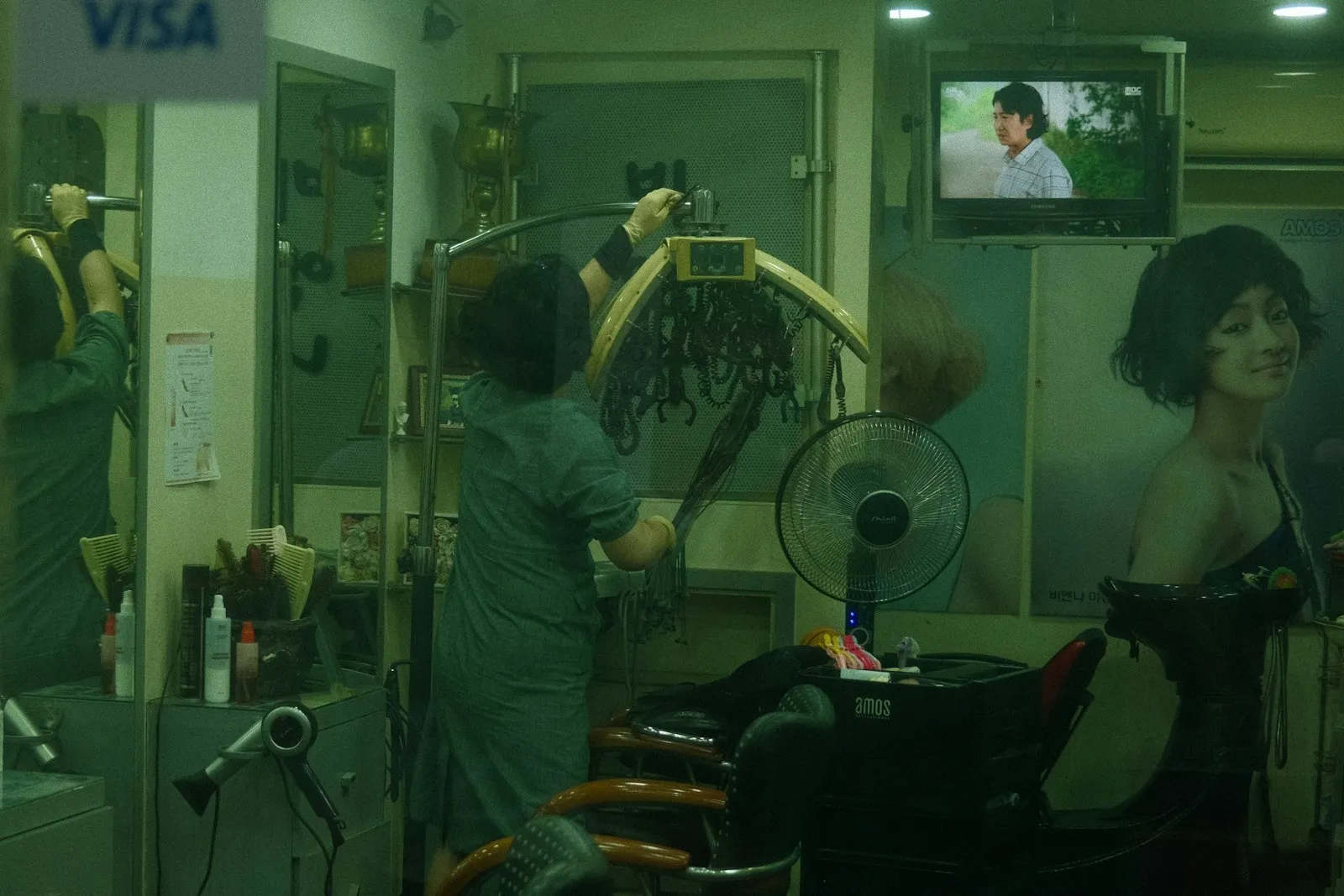 a woman in a hair salon getting her hair done