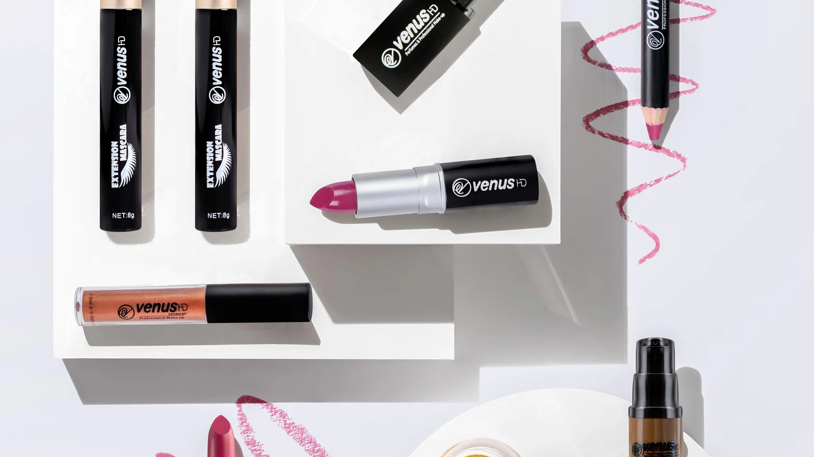 Cosmetic tubes, an open lipstick and a pump bottle arranged on white blocks.